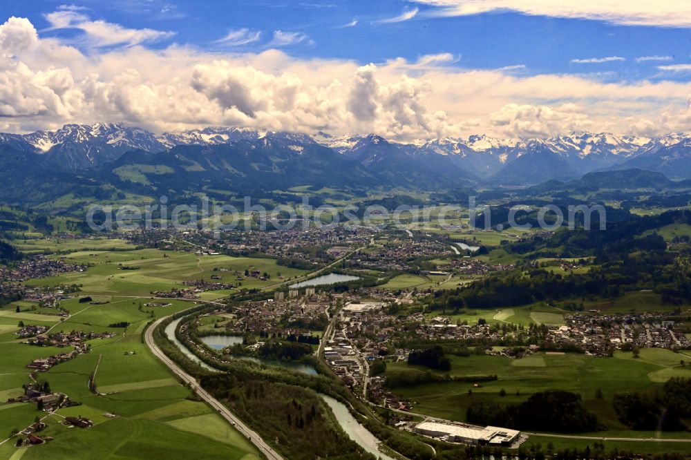 Sonthofen from the bird's eye view: Mountain panorama of the Allgaeu Alps in Sonthofen in the state of Bavaria. Sonthofen is surrounded by mountain tops and mountains of the Alps. Meadows, fields and villages are located in broad valleys which are surrounded by the snow-covered mountain tops of the mountain range