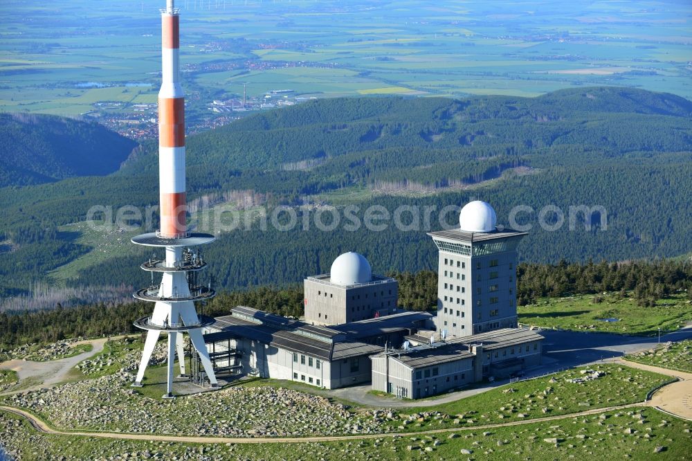 Brocken from above - View of the mountain peak of the Brocken in the Harz - Mountains in the state of Saxony-Anhalt. The rock band the Brocken is designated as a national park and nature reserve. The radio and transmitter towers of Deutsche Telekom are visible from afar .