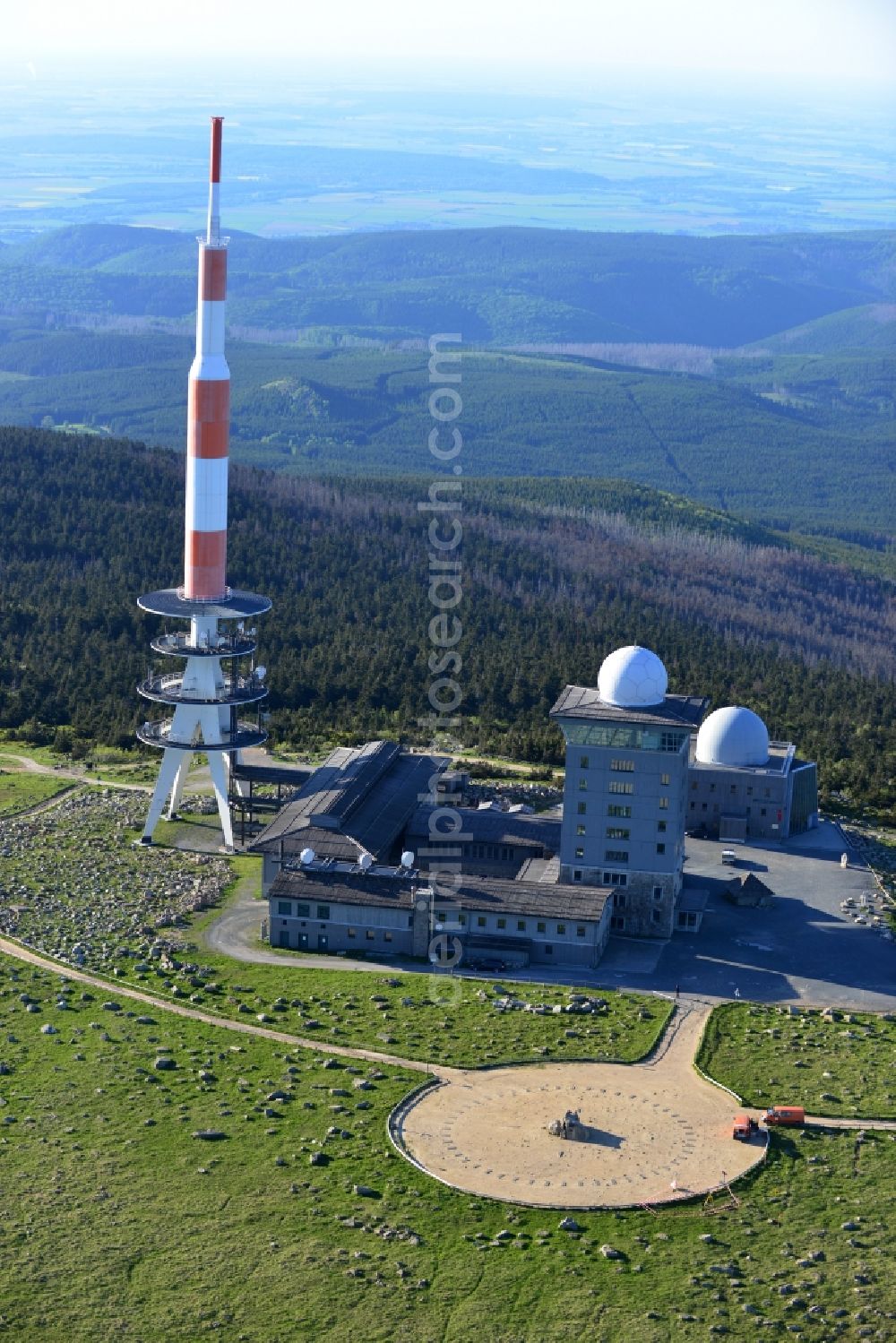 Brocken from the bird's eye view: View of the mountain peak of the Brocken in the Harz - Mountains in the state of Saxony-Anhalt. The rock band the Brocken is designated as a national park and nature reserve. The radio and transmitter towers of Deutsche Telekom are visible from afar .