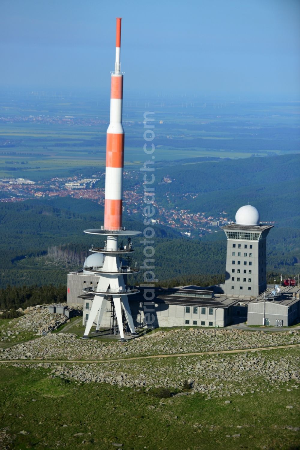 Brocken from above - View of the mountain peak of the Brocken in the Harz - Mountains in the state of Saxony-Anhalt. The rock band the Brocken is designated as a national park and nature reserve. The radio and transmitter towers of Deutsche Telekom are visible from afar .