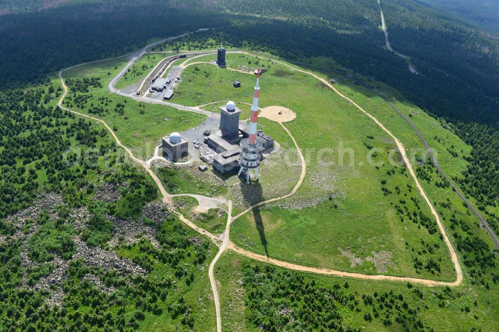 Brocken from above - View of the mountain peak of the Brocken in the Harz - Mountains in the state of Saxony-Anhalt. The rock band the Brocken is designated as a national park and nature reserve. The radio and transmitter towers of Deutsche Telekom are visible from afar 