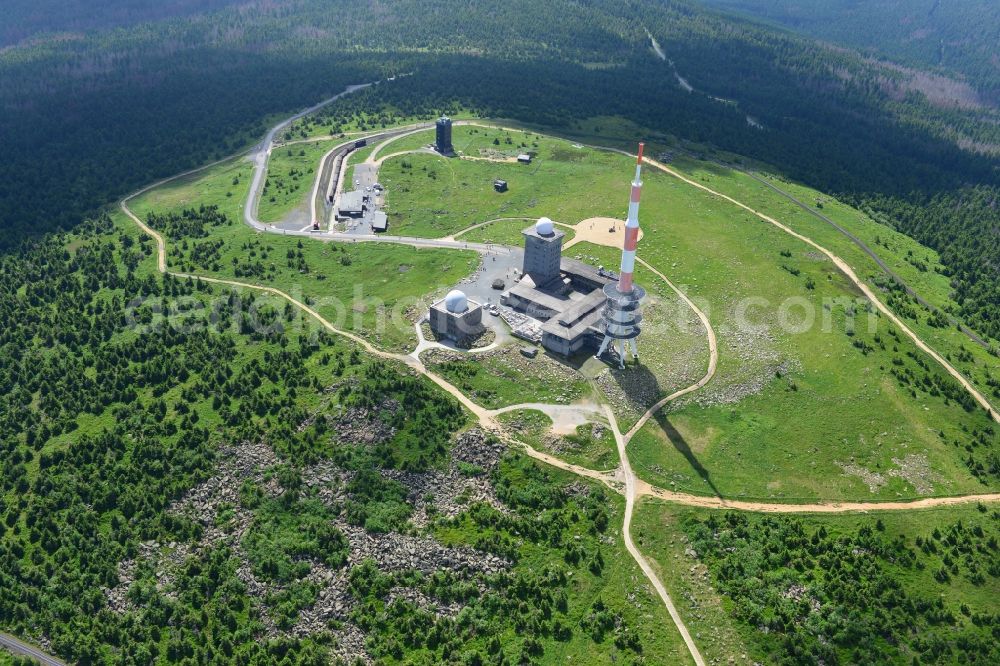 Brocken from the bird's eye view: View of the mountain peak of the Brocken in the Harz - Mountains in the state of Saxony-Anhalt. The rock band the Brocken is designated as a national park and nature reserve. The radio and transmitter towers of Deutsche Telekom are visible from afar 