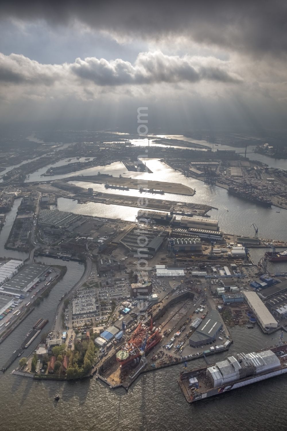 Aerial image Hamburg - View of overhaul and maintenance work on the research vessel Petrojarl Banff in dry dock of Blohm and Voss Dock Elbe in Hamburg. The dry dock Elbe 17 is one of the largest dry dock in Europe. It is located on the grounds of the Blohm + Voss shipyard in Hamburg harbor