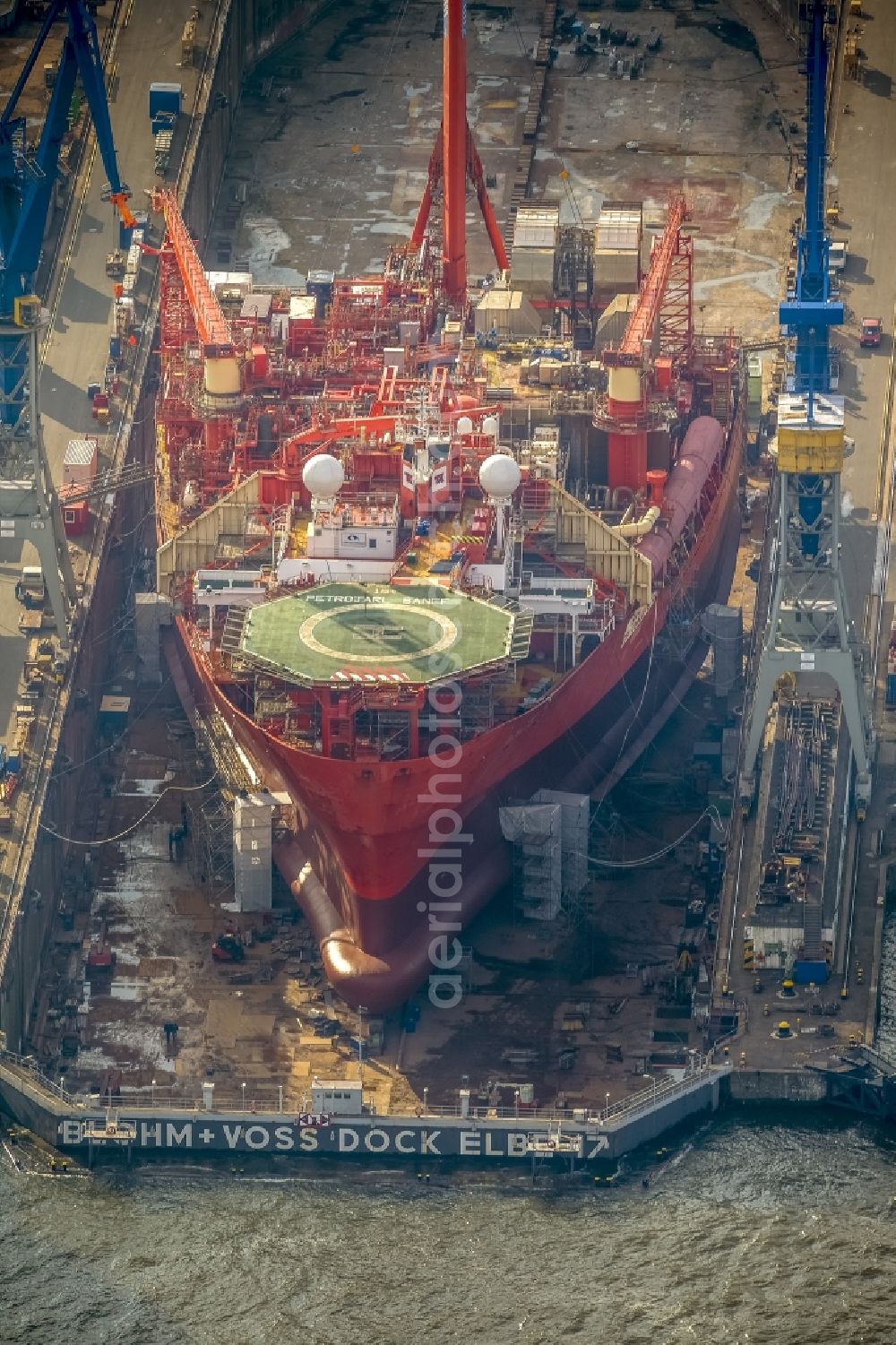 Aerial photograph Hamburg - View of overhaul and maintenance work on the research vessel Petrojarl Banff in dry dock of Blohm and Voss Dock Elbe in Hamburg. The dry dock Elbe 17 is one of the largest dry dock in Europe. It is located on the grounds of the Blohm + Voss shipyard in Hamburg harbor