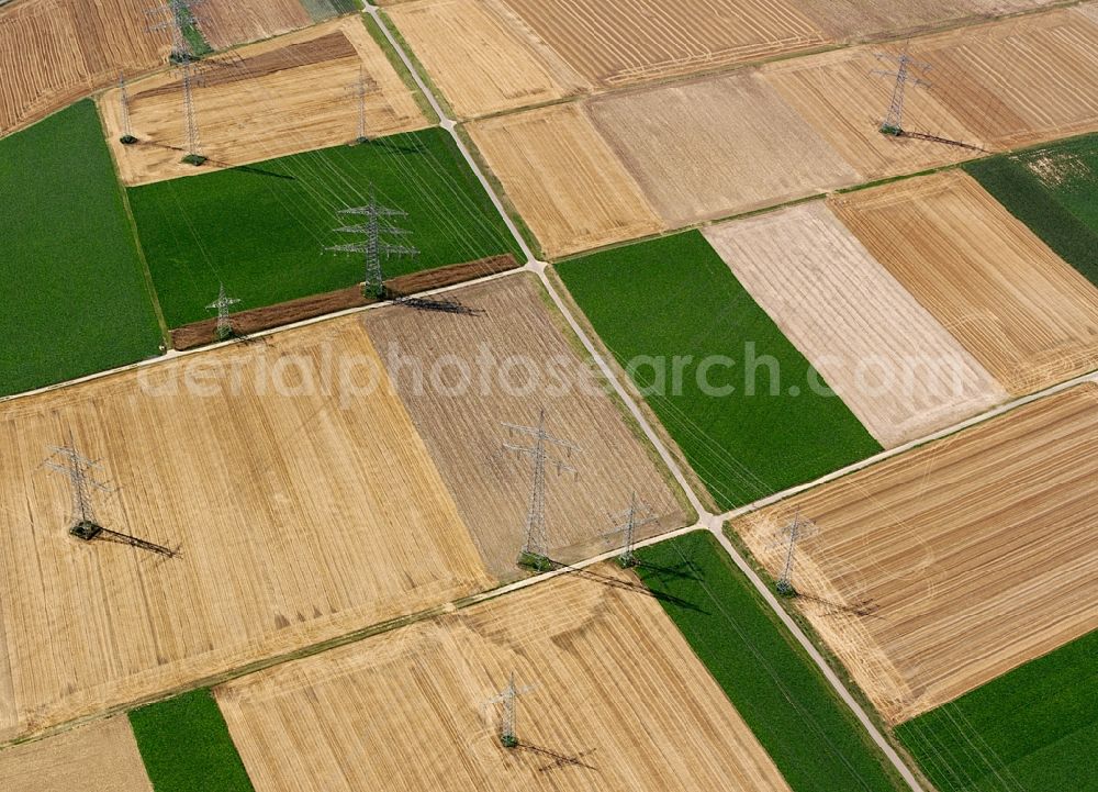 Heilbronn from above - Transmission lines and acres in the county district of Heilbronn in the state of Baden-Württemberg. The high voltage power lines are set up along the fields and acres in the district and the region. The different sizes, geometries and structures of the various fields in summer are very well visible