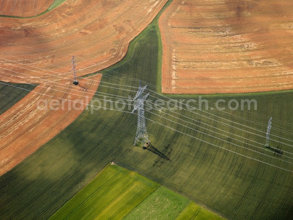 Aerial photograph Heilbronn - Transmission lines and acres in the county district of Heilbronn in the state of Baden-Württemberg. The high voltage power lines are set up along the fields and acres in the district and the region. The different sizes, geometries and structures of the various fields in summer are very well visible