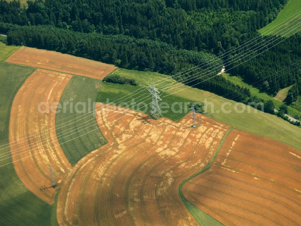 Heilbronn from above - Transmission lines and acres in the county district of Heilbronn in the state of Baden-Württemberg. The high voltage power lines are set up along the fields and acres in the district and the region. The different sizes, geometries and structures of the various fields in summer are very well visible