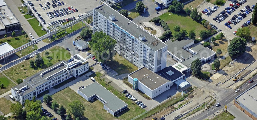 Aerial image Berlin - Blick auf das Gelände der Berlin Chemie AG. Das Berliner Pharmaunternehmen ist Teil des Pharmakonzerns Menarini, dem größten italienischen Pharmaunternehmen. View of the grounds of the Berlin Chemie AG. The pharmaceutical company is a german subsidiary of the Menarini Group, which has been occupying a leading position in the Italian pharmaceutical market for many years.