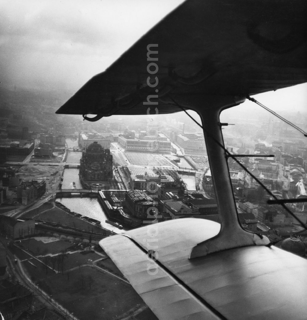 Berlin from the bird's eye view: Berlin Cathedral and Museum Island on the banks of Spee in the center of downtown Berlin in the state of Berlin from the fixed-wing view of an aircraft Antonov AN-2 in flight over the capital of the German Democratic Republic German Democratic Republic