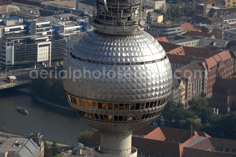 Berlin from the bird's eye view: Der Berliner Fernsehturm ist mit 368 m das höchste Bauwerk Deutschlands und das vierthöchste freistehende Bauwerk Europas. Er befindet sich im östlichen Zentrum in Berlin-Mitte. Im Hintergrund ist die Spree zu sehen, sowie die Jannowitzbrücke. Berlin 2007/09/14 The Fernsehturm is a television tower in the center of Berlin, close to the Alexanderplatz. ol of the city. The picture shows the dome, where inside the visitor platform an the rotating restaurant in the middle of the sphere is. You can also see the river Spree and the Jannowitz-bridge.