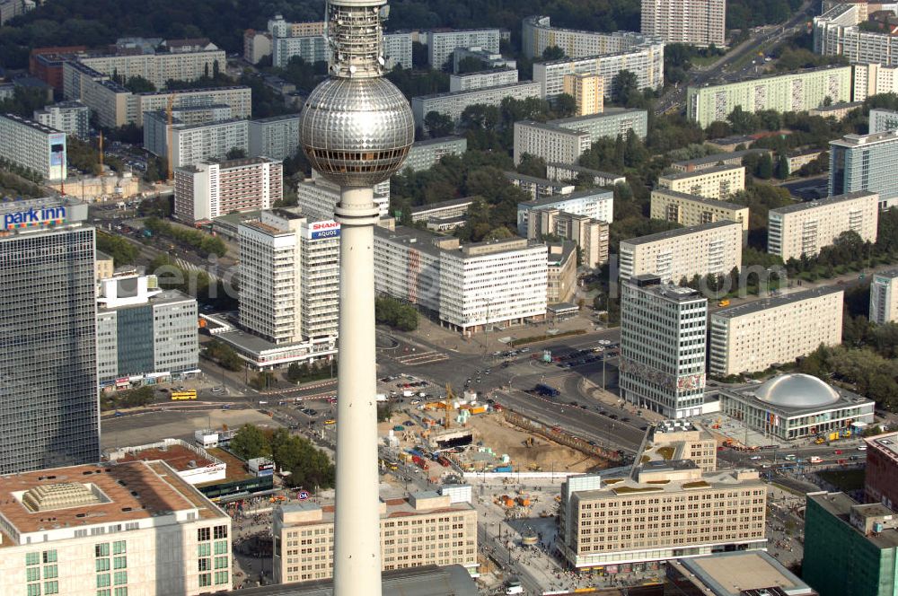 Berlin from above - Der Berliner Fernsehturm ist mit 368 m das höchste Bauwerk Deutschlands und das vierthöchste freistehende Bauwerk Europas. Er befindet sich im östlichen Zentrum in Berlin-Mitte. Zu sehen ist auch die silberne Kuppel der Kongresshalle, daneben das Haus des Lehrers, sowie gegenüber das Hotel Park Inn. Berlin 2007/09/14 The Fernsehturm is a television tower in the center of Berlin, close to the Alexanderplatz. The tower was built between 1965 and 1969 by the former German Democratic Republic (GDR), and its image was used as a symbol of Berlin by the GDR administration. The tower is easily visible throughout the central districts of Berlin, and remains a symbol of the city.