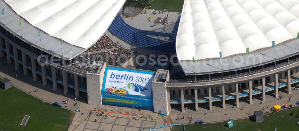 Aerial image Berlin - Blick auf das Berliner Olympiastadion, am Tag der Eröffnung der Leichtathletik WM 2009. Vom 15. bis 23. August 2009 findet in Berlin das weltgrößte Sportevent des Jahres 2009 statt - die Leichtathletik Weltmeisterschaft. Rund 1.800 Top-Athleten aus den 213 Mitgliedsverbänden des Weltverbandes IAAF treten im Kampf um die Medaillen in 47 Disziplinen im Berliner Olympiastadion an.