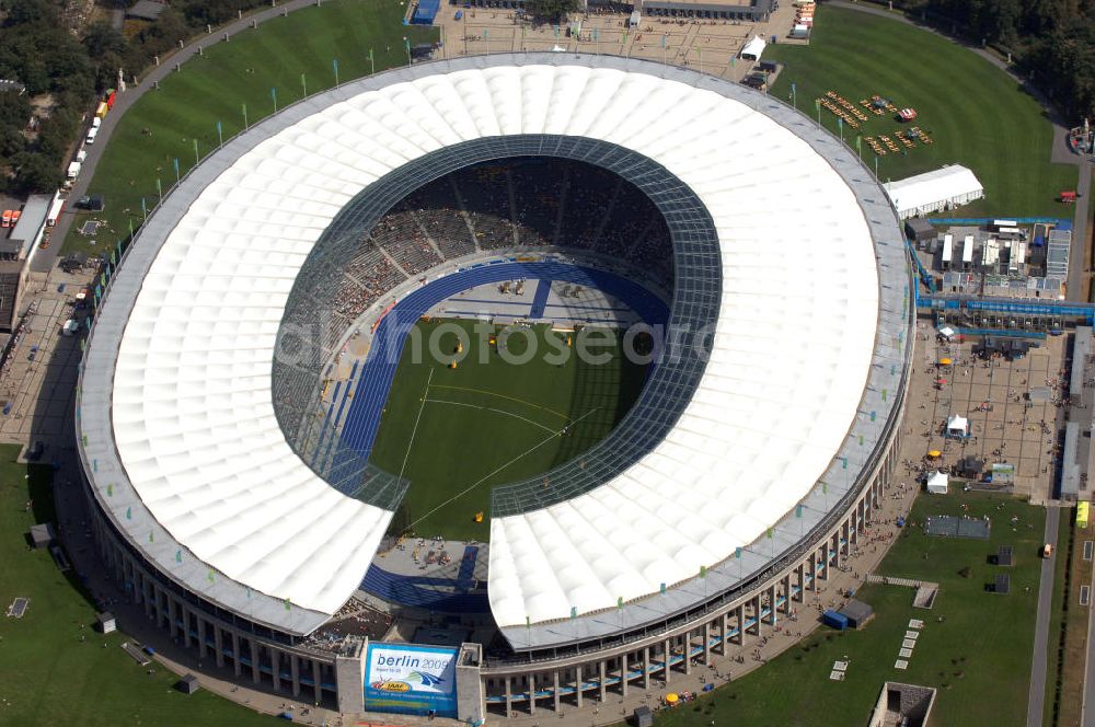 Aerial photograph Berlin - Blick auf das Berliner Olympiastadion, am Tag der Eröffnung der Leichtathletik WM 2009. Vom 15. bis 23. August 2009 findet in Berlin das weltgrößte Sportevent des Jahres 2009 statt - die Leichtathletik Weltmeisterschaft. Rund 1.800 Top-Athleten aus den 213 Mitgliedsverbänden des Weltverbandes IAAF treten im Kampf um die Medaillen in 47 Disziplinen im Berliner Olympiastadion an.