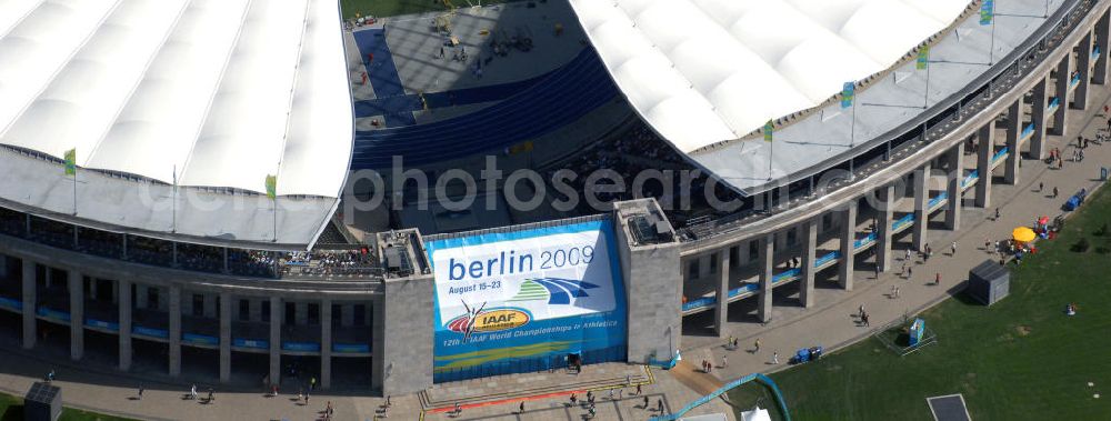 Berlin from the bird's eye view: Blick auf das Berliner Olympiastadion, am Tag der Eröffnung der Leichtathletik WM 2009. Vom 15. bis 23. August 2009 findet in Berlin das weltgrößte Sportevent des Jahres 2009 statt - die Leichtathletik Weltmeisterschaft. Rund 1.800 Top-Athleten aus den 213 Mitgliedsverbänden des Weltverbandes IAAF treten im Kampf um die Medaillen in 47 Disziplinen im Berliner Olympiastadion an.