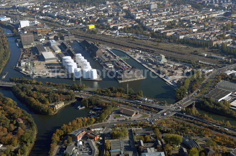 Aerial image Berlin - Der Berliner Westhafen ist ein Binnenhafen im Ortsteil Moabit des Bezirks Mitte. Der Westhafen ist mit einer Fläche von 430.000 m² der größte Hafen der Stadt und ein bedeutender Umschlag- und Lagerplatz für die Binnenschifffahrt. Die Berliner Hafen-und Lagerhausgesellschaft mbH, kurz BEHALA genannt, betreibt in Berlin mehrere Binnenhäfen mit den dazugehörigen Lagerhäusern, dem Güterumschlag, einer Bauschuttentsorgung, den Hafenbahnen, und die Vermietung von Immobilien auf den Hafengeländen. Sie ist ein Eigenbetrieb der Stadt Berlin. Weitere Informationen unter