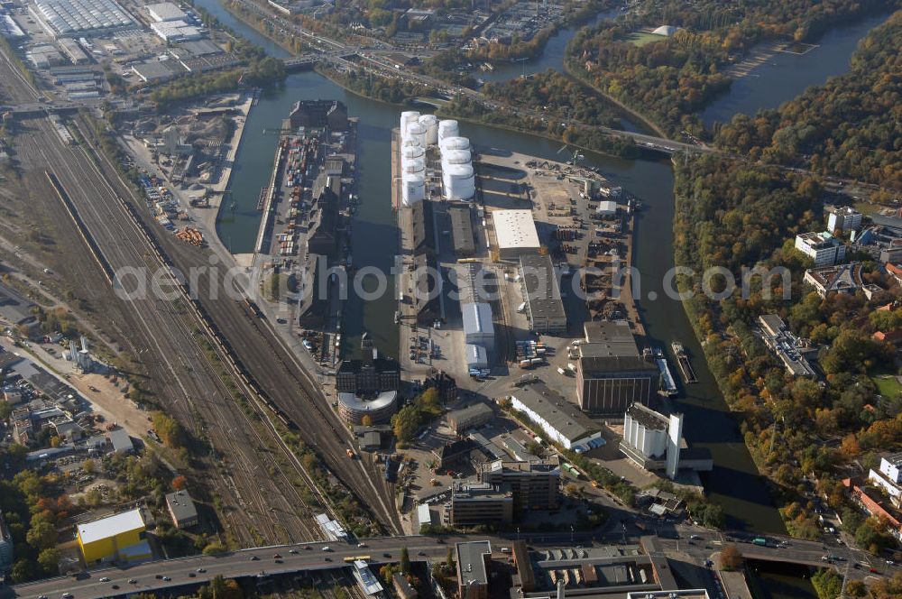 Aerial image Berlin - Der Berliner Westhafen ist ein Binnenhafen im Ortsteil Moabit des Bezirks Mitte. Der Westhafen ist mit einer Fläche von 430.000 m² der größte Hafen der Stadt und ein bedeutender Umschlag- und Lagerplatz für die Binnenschifffahrt. Die Berliner Hafen-und Lagerhausgesellschaft mbH, kurz BEHALA genannt, betreibt in Berlin mehrere Binnenhäfen mit den dazugehörigen Lagerhäusern, dem Güterumschlag, einer Bauschuttentsorgung, den Hafenbahnen, und die Vermietung von Immobilien auf den Hafengeländen. Sie ist ein Eigenbetrieb der Stadt Berlin. Weitere Informationen unter