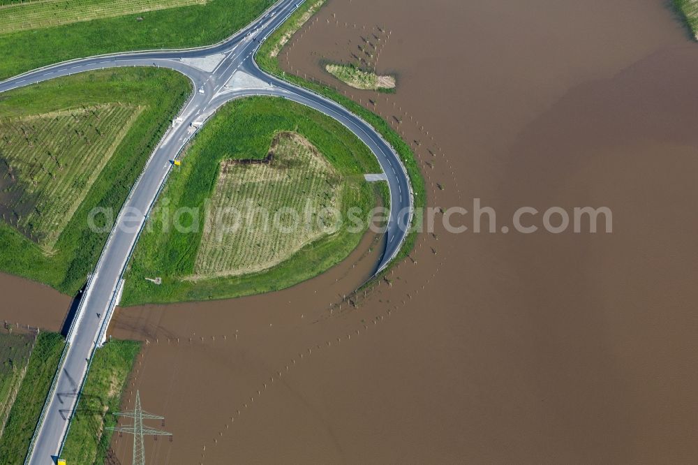 Coswig from the bird's eye view: Flooding of a roundabout close to Coswig in the Free State of Saxony during the flooding and high water levels of the Elbe river. The roundabout is located on the S84 at the exit of the village of Naundorf