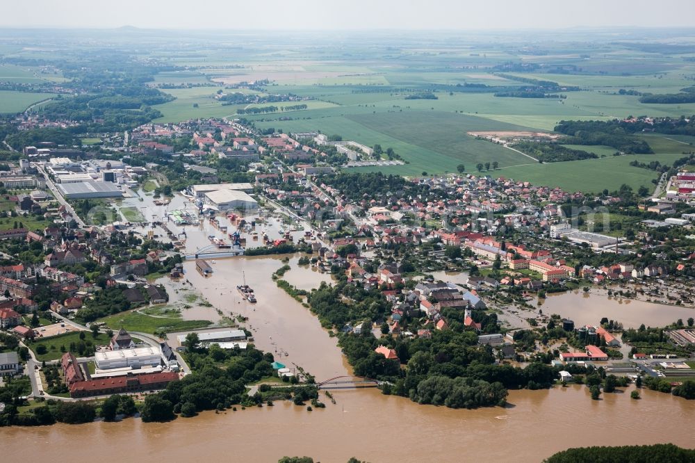 Riesa from above - Flooding due to high water on the North and South shore of the Elbe river at the city of Riesa in the state of Saxony. Affected are farms, industrial buildings and residential areas