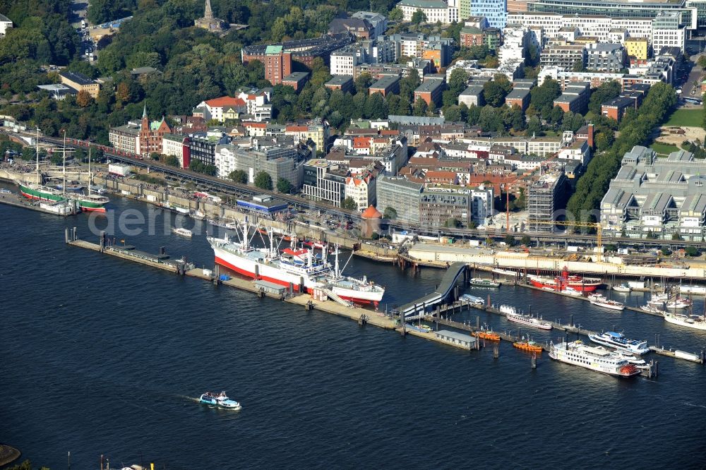 Aerial photograph Hamburg - Ueberseebruecke at the harbor in Hamburg. Inter alia, the docks are berth for the ships Cap San Diego which is a museum and Feuerschiff, which is a restaurant