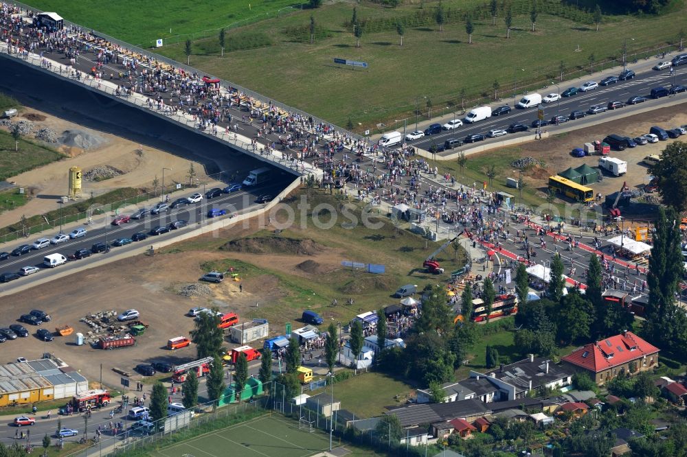 Aerial photograph Dresden - Visitors and pedestrians at the opening after completion of Waldschloesschenbrücke on the river Elbe in Dresden in Saxony