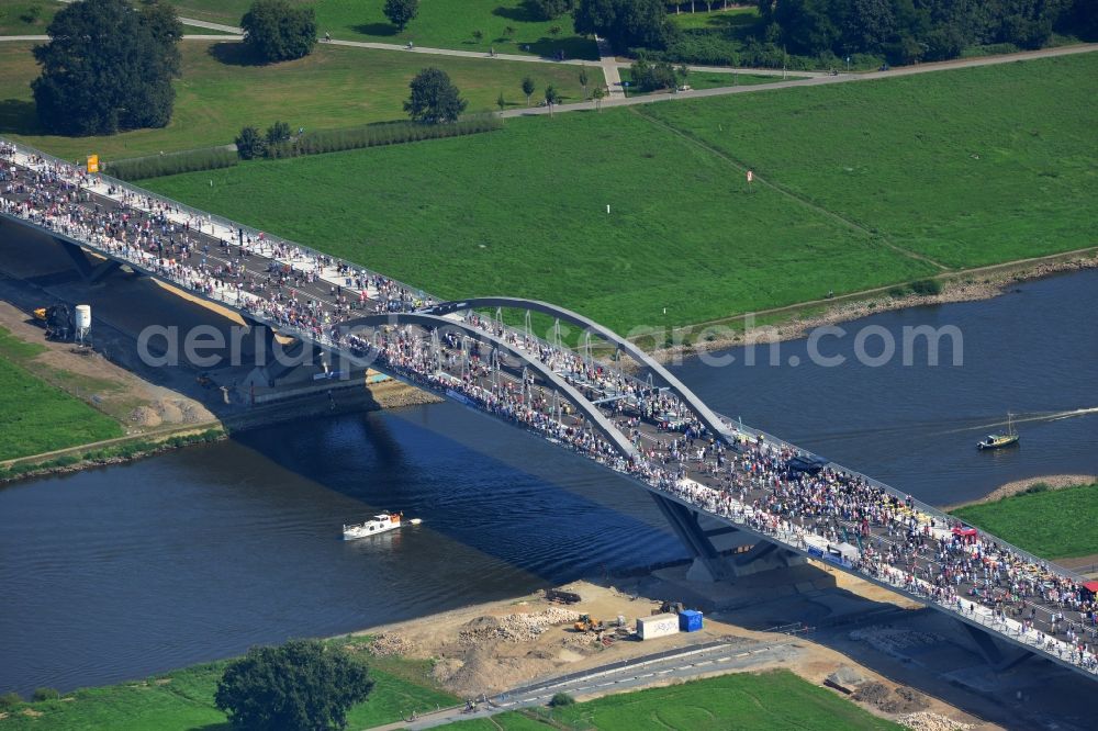 Dresden from above - Visitors and pedestrians at the opening after completion of Waldschloesschenbrücke on the river Elbe in Dresden in Saxony