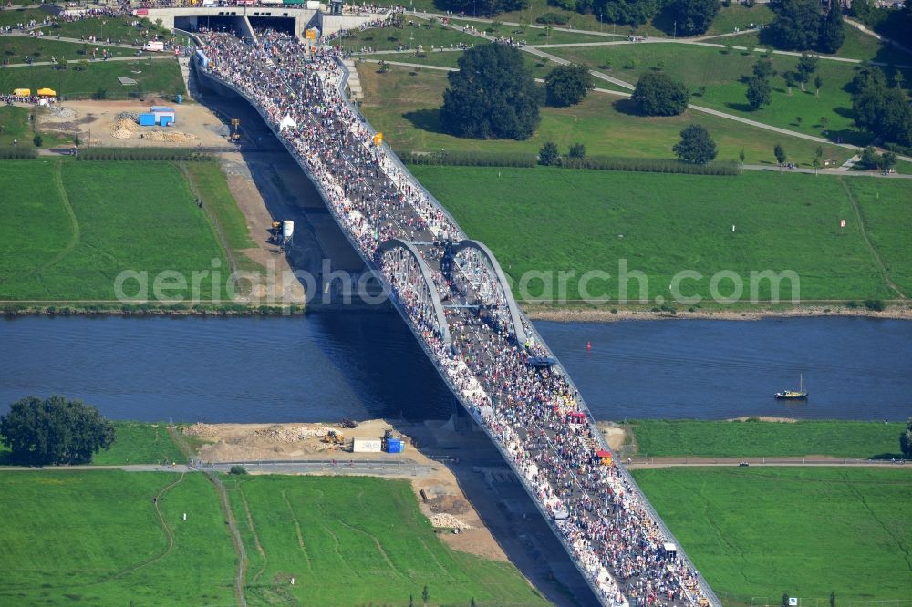 Dresden from the bird's eye view: Visitors and pedestrians at the opening after completion of Waldschloesschenbrücke on the river Elbe in Dresden in Saxony