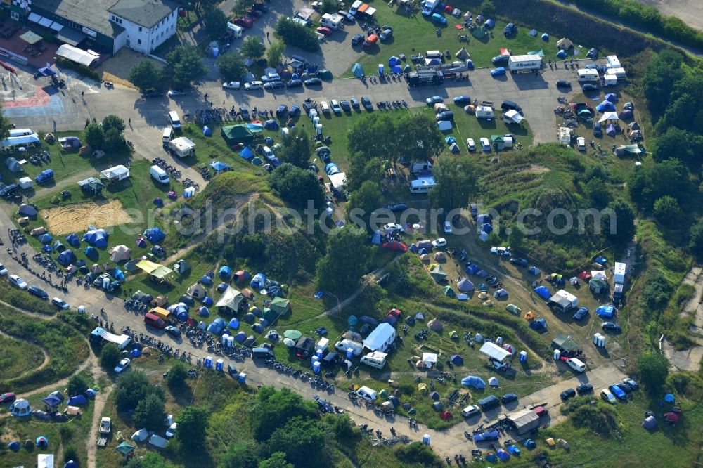 Aerial photograph JÜTERBOG - Views of visitors to the Motorcycle Jamboree Festival on the disused runway of the airfield Altes Lager in Jueterbog in the state of Brandenburg. The Motorcycle Jamboree is aimed primarily at motorcycle enthusiasts. It play music live bands in the style of Rock, Hard Rock, Blues Rock, Heavy Metal and there is a program with bike shows, motorcycle games. http://