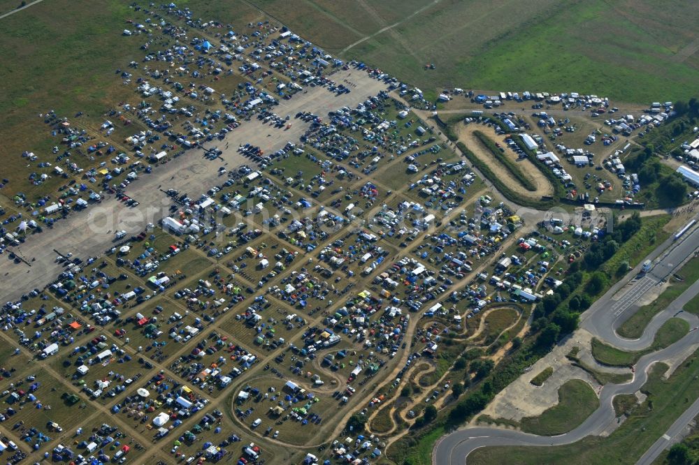 JÜTERBOG from the bird's eye view: Views of visitors to the Motorcycle Jamboree Festival on the disused runway of the airfield Altes Lager in Jueterbog in the state of Brandenburg. The Motorcycle Jamboree is aimed primarily at motorcycle enthusiasts. It play music live bands in the style of Rock, Hard Rock, Blues Rock, Heavy Metal and there is a program with bike shows, motorcycle games. http://