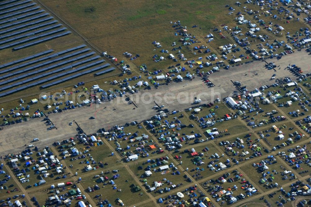 Aerial image JÜTERBOG - Views of visitors to the Motorcycle Jamboree Festival on the disused runway of the airfield Altes Lager in Jueterbog in the state of Brandenburg. The Motorcycle Jamboree is aimed primarily at motorcycle enthusiasts. It play music live bands in the style of Rock, Hard Rock, Blues Rock, Heavy Metal and there is a program with bike shows, motorcycle games. http://