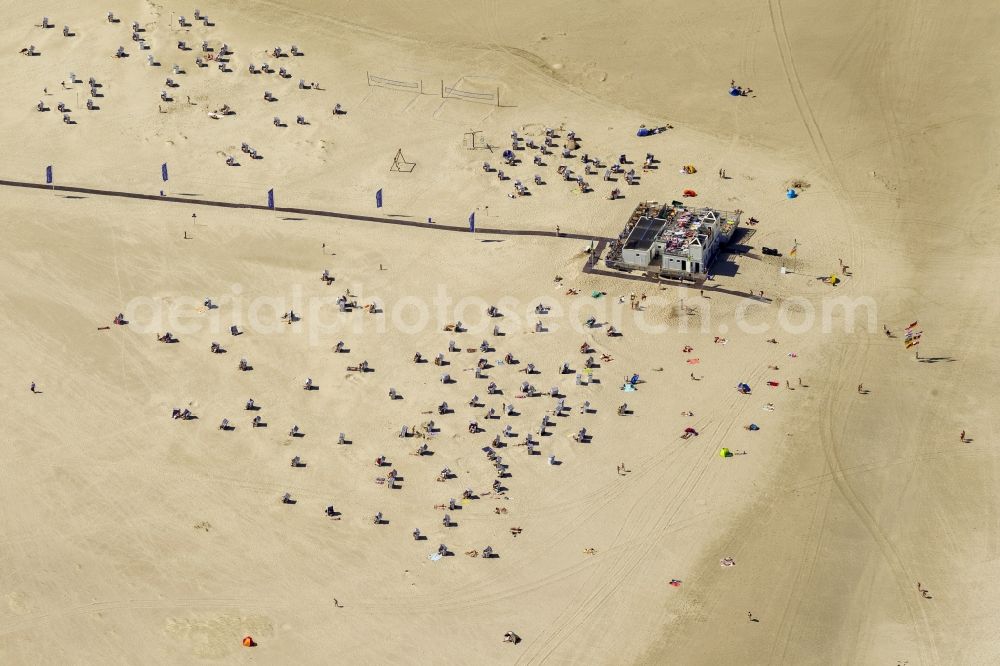 Norderney from above - Visitors on the sandy beach of the island of Norderney in the North Sea in Lower Saxony