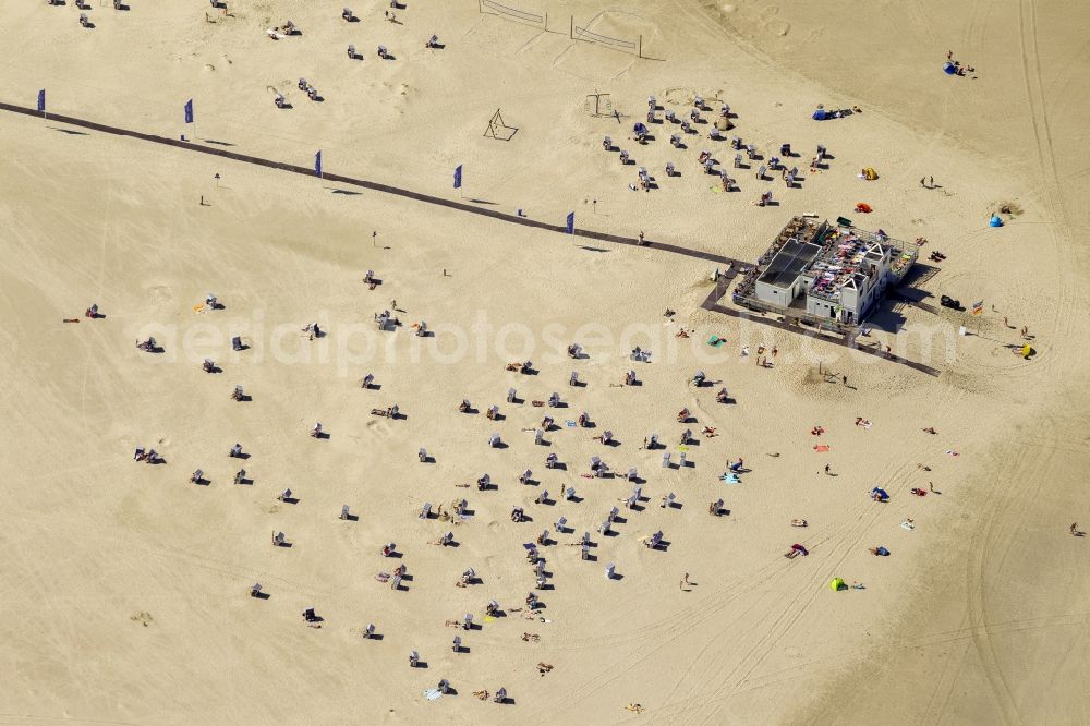 Norderney from the bird's eye view: Visitors on the sandy beach of the island of Norderney in the North Sea in Lower Saxony