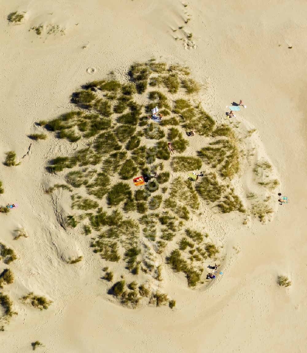 Norderney from the bird's eye view: Visitors on the sandy beach of the island of Norderney in the North Sea in Lower Saxony