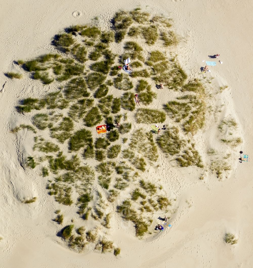 Norderney from above - Visitors on the sandy beach of the island of Norderney in the North Sea in Lower Saxony