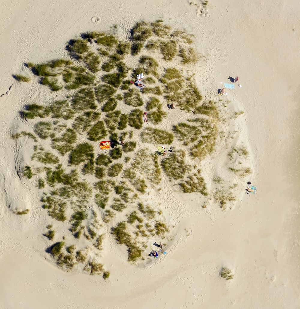 Norderney from the bird's eye view: Visitors on the sandy beach of the island of Norderney in the North Sea in Lower Saxony