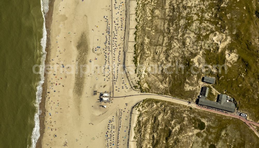 Norderney from above - Visitors on the sandy beach of the island of Norderney in the North Sea in Lower Saxony