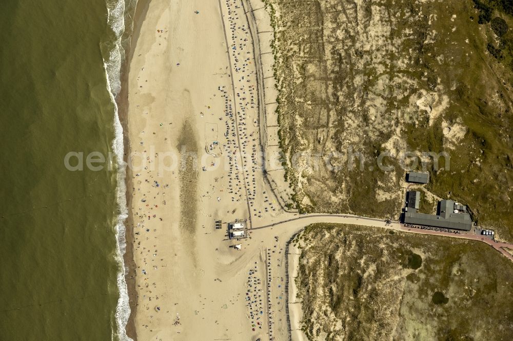 Norderney from the bird's eye view: Visitors on the sandy beach of the island of Norderney in the North Sea in Lower Saxony