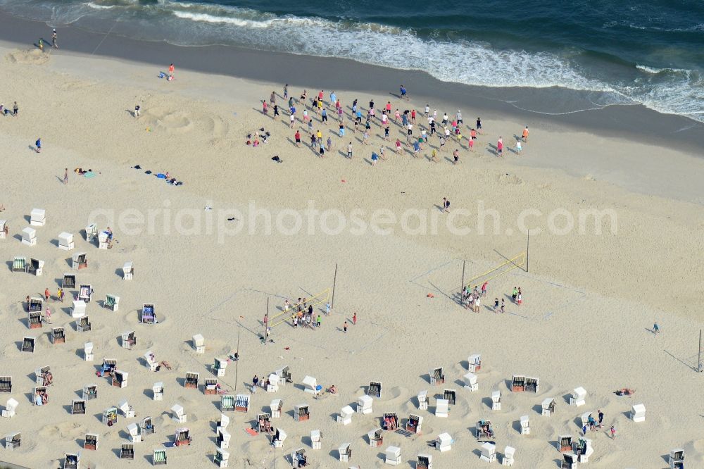 Aerial photograph Wangerooge - Visitors, beach chairs and sports group on the main beach of the island Wangerooge in the Wadden Sea of the North Sea in the state of Lower Saxony. Wangerooge is the Eastern-most inhabited of the East Frisian Islands. It has a sand beach and is a spa resort