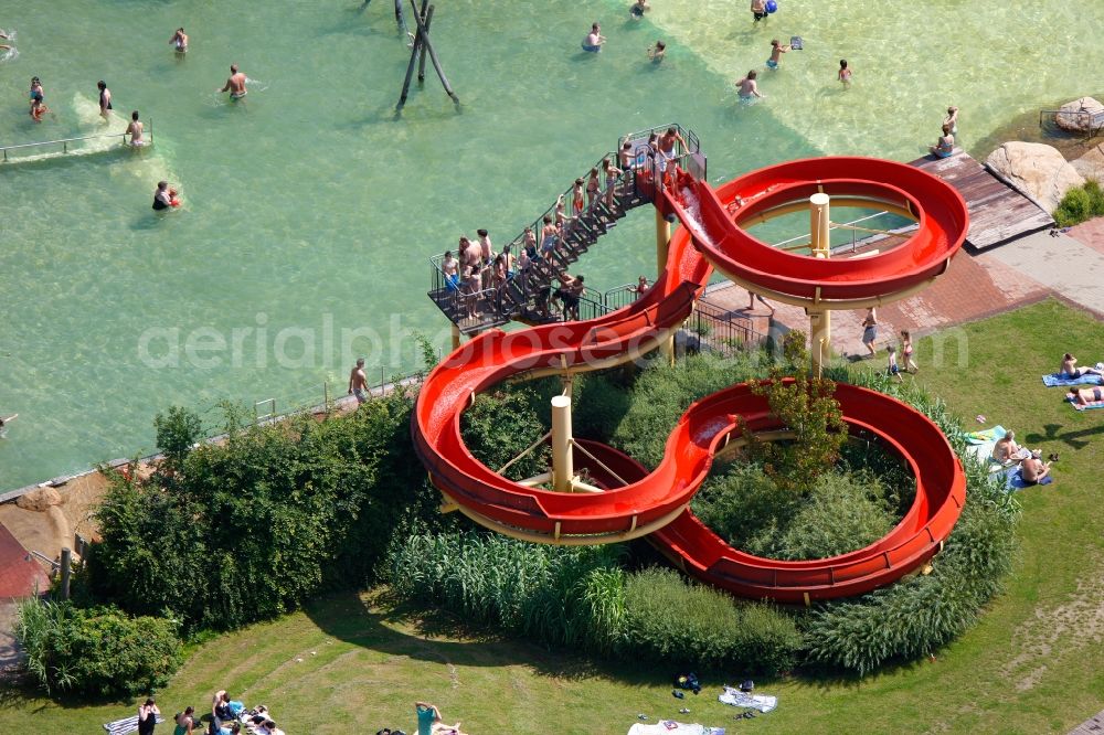 Duisburg from above - Visitors on the water slide and the lawn at the swimming pool in Duisburg in North Rhine-Westphalia