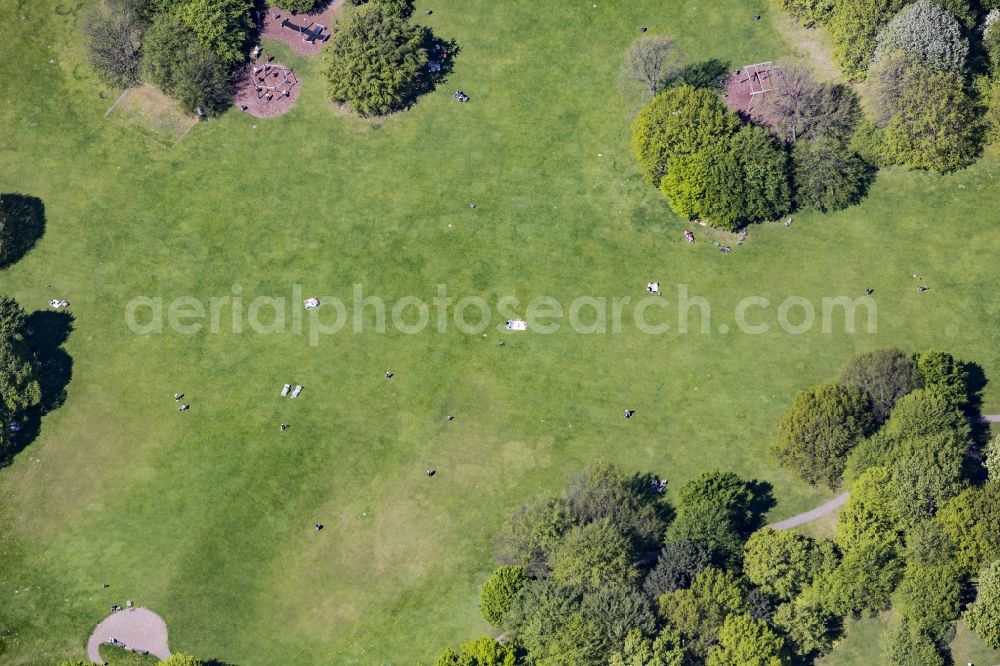 Berlin from above - Visitors on a lawn in the Britzer Garten park in the Britz part of the district of Neukoelln in Berlin