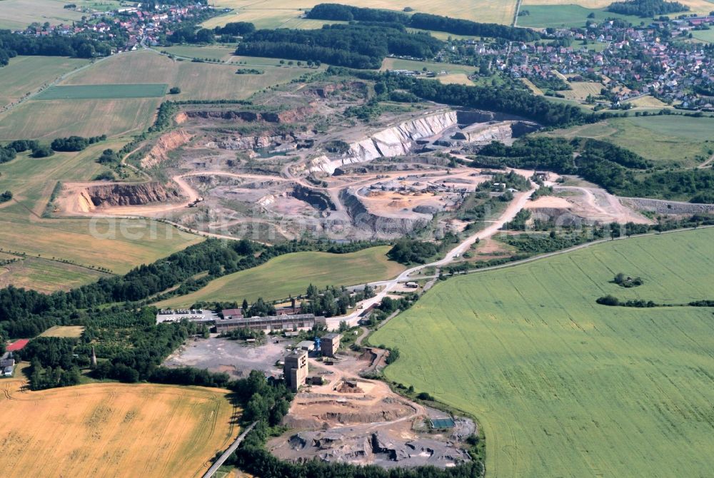 Unterwellenborn from above - From the 15th century until the middle of the last century was operated in the district Kamsdorf of Unterwellenborn in Thuringia mining. Here are ores mined last Zechstein limestone for steel industry. Today is located on the site of an agreed-run exhibition mine. In mining, greywacke is still recovered as gravel