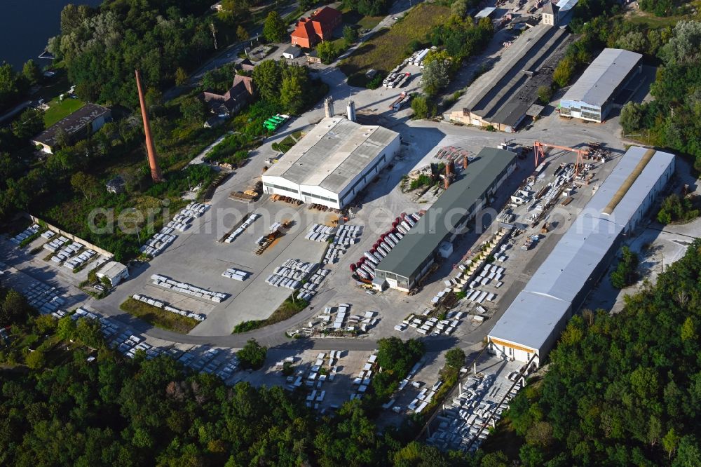 Rüdersdorf from above - Mixed concrete and building materials factory of TBG Transportbeton Oder-Spree GmbH & Co. KG of factory Hennickendorf on Berliner Strasse in the district Hennickendorf in Ruedersdorf in the state Brandenburg, Germany