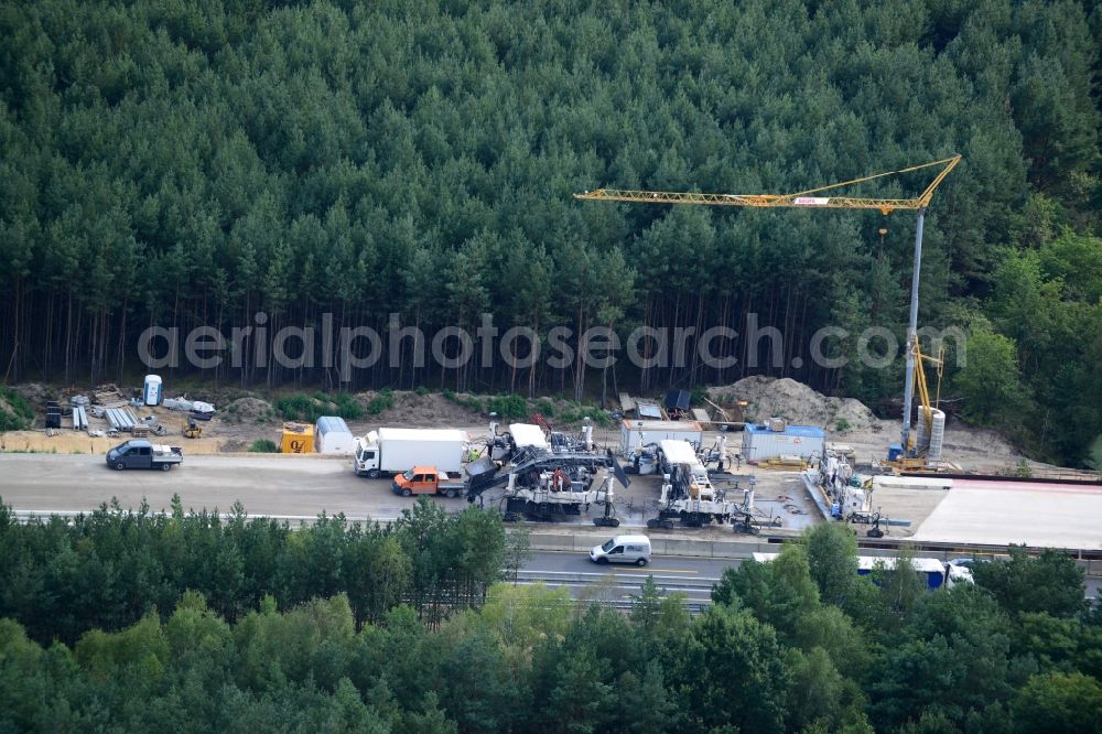 Aerial image Friedersdorf - View expansion and widening of the route of the highway / motorway BAB A12 / E30 Markgrafpieske in the state of Brandenburg. The picture shows a concrete paver contractorBickhardt Bau in the production of the new road surface