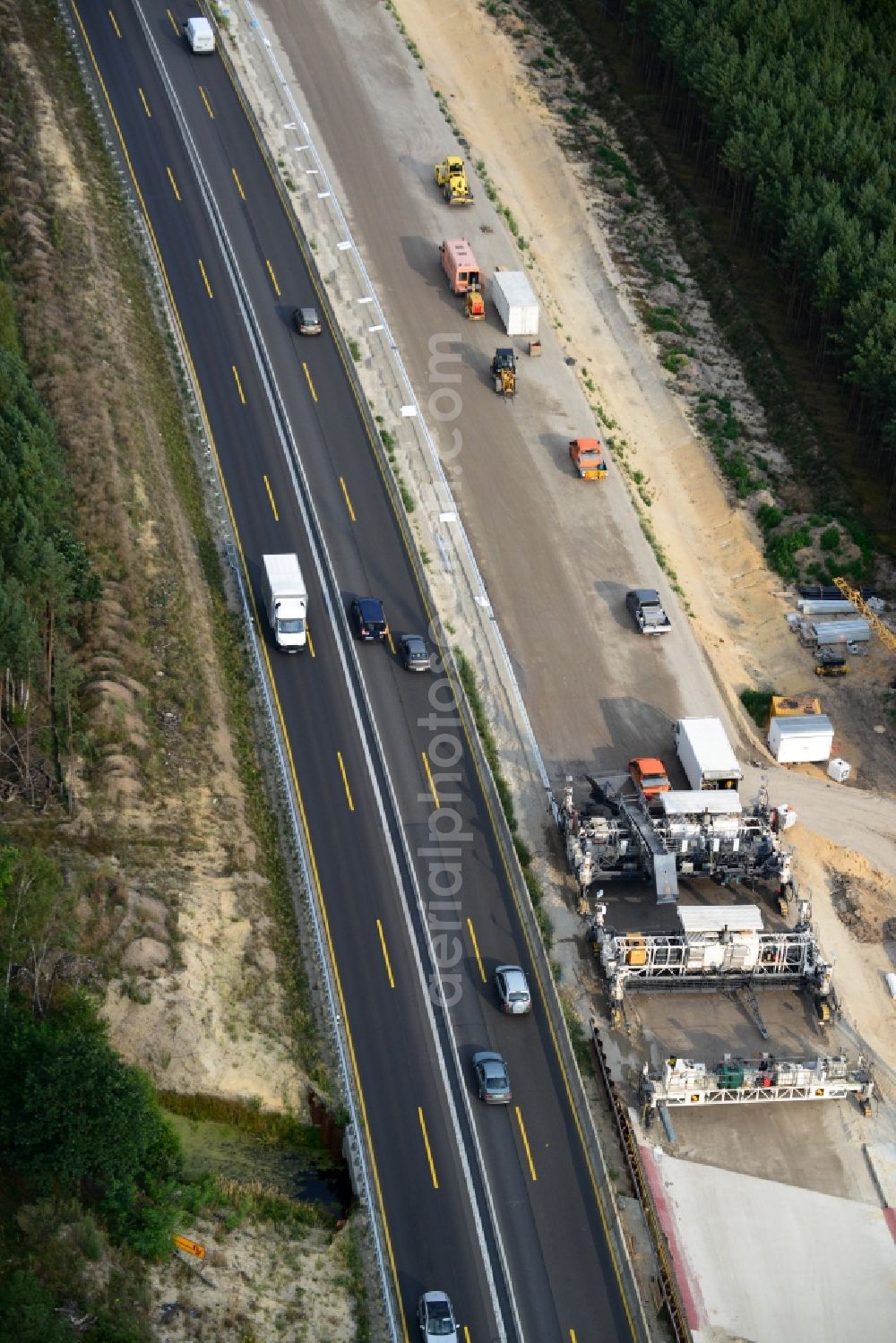 Aerial image Friedersdorf - View expansion and widening of the route of the highway / motorway BAB A12 / E30 Markgrafpieske in the state of Brandenburg. The picture shows a concrete paver contractorBickhardt Bau in the production of the new road surface