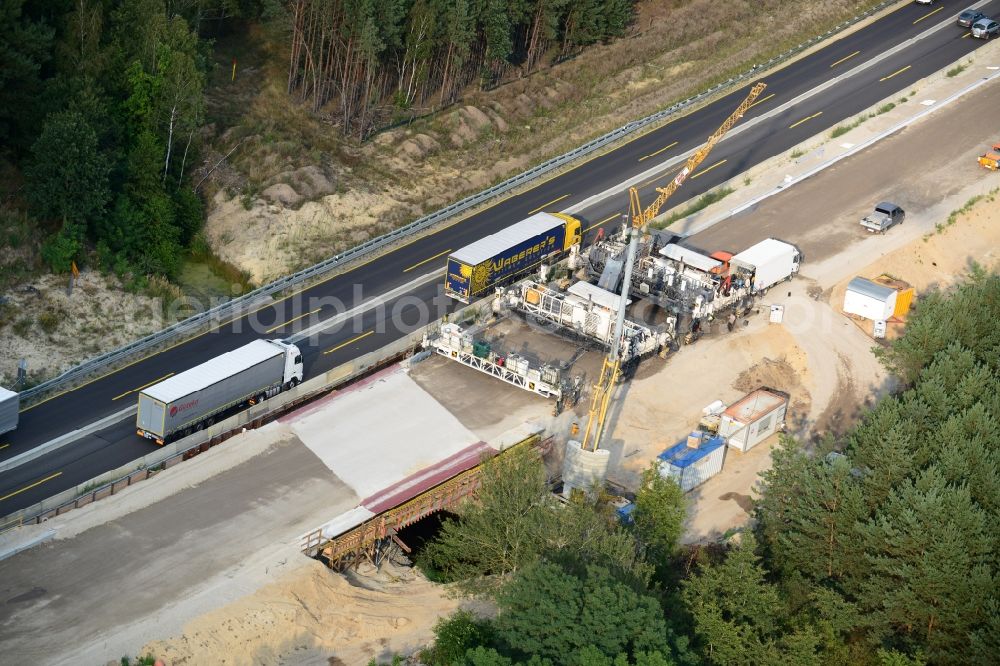 Aerial image Friedersdorf - View expansion and widening of the route of the highway / motorway BAB A12 / E30 Markgrafpieske in the state of Brandenburg. The picture shows a concrete paver contractorBickhardt Bau in the production of the new road surface