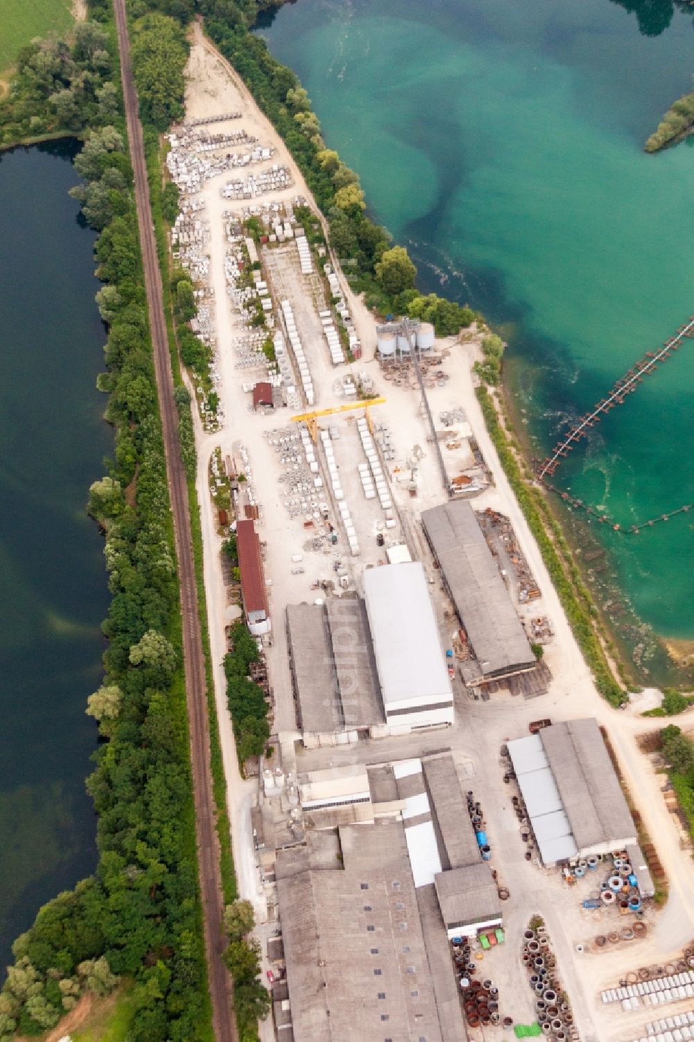 Aerial photograph Philippsburg - Mixed concrete parts factory at a lake in the district Rheinsheim in Philippsburg in the state Baden-Wuerttemberg, Germany