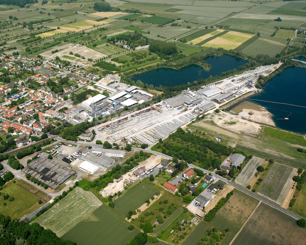 Philippsburg from the bird's eye view: Mixed concrete parts factory at a lake on street Huttenheimer Strasse in the district Rheinsheim in Philippsburg in the state Baden-Wuerttemberg, Germany