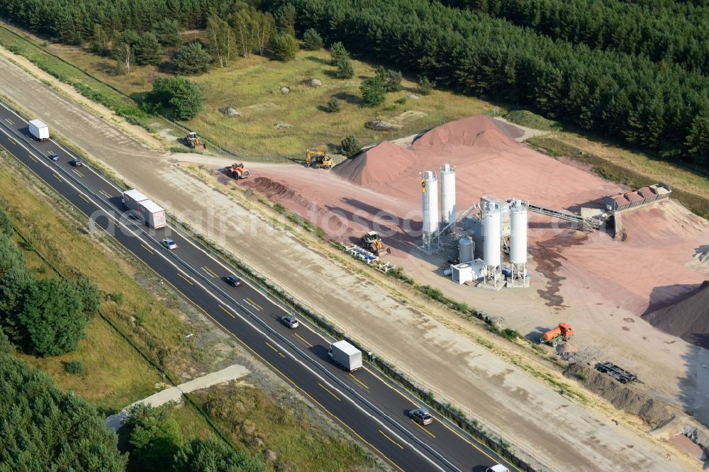 Friedrichshof from the bird's eye view: Concrete mixing plant to the expansion and widening of the route of the highway / motorway BAB A12 at Friedersdorf at the Berliner Ring in Brandenburg