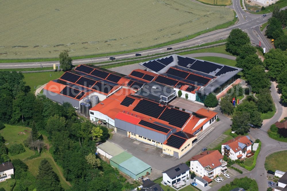 Efringen-Kirchen from above - Buildings and storage Depot on the premises of the cooperative wine-growers association Bezirkskellerei Markraeflerland in Efringen-Kirchen in the state Baden-Wurttemberg, Germany