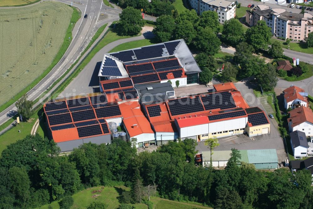 Efringen-Kirchen from the bird's eye view: Buildings and storage Depot on the premises of the cooperative wine-growers association Bezirkskellerei Markraeflerland in Efringen-Kirchen in the state Baden-Wurttemberg, Germany