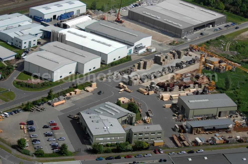 Aerial photograph Oebisfelde - Blick auf den Betriebshof der EUROVIA Beton GmbH am Gewerbegebiet West 7 in 39646 Oebisfelde in Sachsen-Anhalt. Die EUROVIA Infrastructure GmbH ist ein führendes Unternehmen im Verkehrswegebau. View of the depot, the concrete EUROVIA Infrastructure GmbH on industrial West 7 in 39646 Oebisfelde in Saxony-Anhalt. The EUROVIA Infrastructure GmbH is a leading company in road construction.